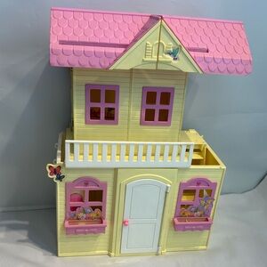 Vintage Barbie Kelly Pop Up Yellow Playhouse with some accessories.